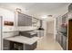 Classic kitchen with gray cabinets, durable laminate countertops, and efficient appliances at 9347 E Edgewood Ave, Mesa, AZ 85208