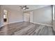 Spacious bedroom features hardwood flooring and ceiling fan for added comfort at 9437 W Georgia Ave, Glendale, AZ 85305