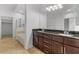 Bathroom featuring dual sinks, granite countertops, and a separate tub and shower at 945 E Playa Del Norte Dr # 1016, Tempe, AZ 85288