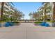 Open common area with palm trees and manicured planters offering relaxing, symmetric views at 945 E Playa Del Norte Dr # 1016, Tempe, AZ 85288