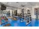 A bright community gym with modern weightlifting equipment, mirrors, and tv at 945 E Playa Del Norte Dr # 1016, Tempe, AZ 85288