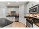 Stylish kitchen featuring granite countertops, stainless steel appliances, and mosaic backsplash at 945 E Playa Del Norte Dr # 1016, Tempe, AZ 85288