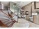 Elegant lobby with a grand staircase, chandelier, metal art feature and concierge desk at 945 E Playa Del Norte Dr # 1016, Tempe, AZ 85288