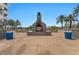 Inviting pool area with fireplace, lounge chairs, and palm trees for relaxation at 945 E Playa Del Norte Dr # 1016, Tempe, AZ 85288