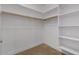 Walk-in closet with shelving and rod for ample storage space at 945 E Playa Del Norte Dr # 1016, Tempe, AZ 85288
