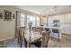 Elegant dining room featuring a wooden table, chairs, and a view of the kitchen at 9920 E Tamery Ave, Mesa, AZ 85212