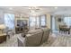 Bright living room featuring stylish decor, hardwood floors, and a view of the dining area at 9920 E Tamery Ave, Mesa, AZ 85212