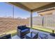 Relaxing covered patio space with outdoor furniture, perfect for entertaining or relaxing at 9920 E Tamery Ave, Mesa, AZ 85212