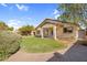 Spacious backyard with green lawn, covered patio, and mature landscaping at 10304 E Plata Ave, Mesa, AZ 85212