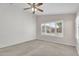 Comfortable bedroom featuring carpet, natural light, and a ceiling fan at 10304 E Plata Ave, Mesa, AZ 85212