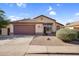 Attractive home featuring a well-maintained front yard and a two-car garage at 10304 E Plata Ave, Mesa, AZ 85212