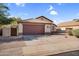Beautiful single-story home featuring a spacious driveway and a two-car garage at 10304 E Plata Ave, Mesa, AZ 85212