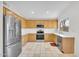 Well-appointed kitchen with stainless steel appliances and light oak cabinetry at 10304 E Plata Ave, Mesa, AZ 85212