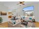 Spacious living room with vaulted ceilings and an open floor plan to the dining area at 10304 E Plata Ave, Mesa, AZ 85212