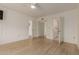 Spacious bedroom featuring wood flooring and access to multiple rooms at 10330 W Thunderbird Blvd # C109, Sun City, AZ 85351