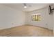 Bright bedroom with hardwood floors and a window with outdoor views at 10330 W Thunderbird Blvd # C109, Sun City, AZ 85351
