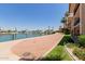 Manicured community area featuring views of a lake and nearby condo buildings at 10330 W Thunderbird Blvd # C109, Sun City, AZ 85351