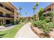 Picturesque courtyard featuring walking paths, manicured lawns, and lush vegetation at 10330 W Thunderbird Blvd # C109, Sun City, AZ 85351