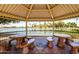 Scenic gazebo with lake views and picnic tables, perfect for relaxing and enjoying the outdoors at 10330 W Thunderbird Blvd # C109, Sun City, AZ 85351