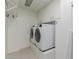 Well-lit laundry room featuring a washer and dryer with white cabinets above at 10330 W Thunderbird Blvd # C109, Sun City, AZ 85351