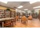 Inviting library with extensive bookshelves, comfortable seating, and tables for reading at 10330 W Thunderbird Blvd # C109, Sun City, AZ 85351