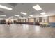 Spacious meeting room featuring neutral walls, rows of chairs and tables, and a grand piano at 10330 W Thunderbird Blvd # C109, Sun City, AZ 85351