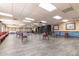 Meeting room with neutral walls, rows of chairs and tables, and decorative art at 10330 W Thunderbird Blvd # C109, Sun City, AZ 85351