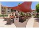 Resort-style patio area with comfortable lounge seating and shade cover for outdoor enjoyment at 10330 W Thunderbird Blvd # C109, Sun City, AZ 85351