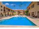 Serene pool area with sun loungers and umbrellas, surrounded by lush landscaping and comfortable seating areas at 10330 W Thunderbird Blvd # C109, Sun City, AZ 85351