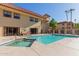 Inviting pool and spa with lounge seating and lush landscaping, set against a backdrop of stucco buildings at 10330 W Thunderbird Blvd # C109, Sun City, AZ 85351