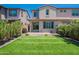 Beautiful backyard with lush lawn, low maintenance landscaping, and a covered patio at 1055 W Diamondback Dr, Chandler, AZ 85286