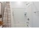 Inviting bathroom with a tiled shower over tub and decorative shower curtain at 1055 W Diamondback Dr, Chandler, AZ 85286
