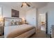Comfortable bedroom with a large bed, soft lighting, and neutral colors at 1055 W Diamondback Dr, Chandler, AZ 85286