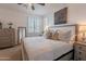 Relaxing bedroom with a plush bed, natural light, and neutral decor at 1055 W Diamondback Dr, Chandler, AZ 85286