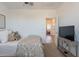 Comfortable bedroom with cozy decor, television, and convenient access to other rooms at 1055 W Diamondback Dr, Chandler, AZ 85286