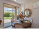 Cozy dining room with a round table, patio access, and stylish decor at 1055 W Diamondback Dr, Chandler, AZ 85286