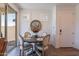 Cozy dining room with a round table, wood flooring, and natural light from the sliding glass doors at 1055 W Diamondback Dr, Chandler, AZ 85286