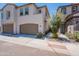 Charming townhome with a two-car garage, well-maintained landscaping, and inviting curb appeal at 1055 W Diamondback Dr, Chandler, AZ 85286