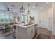 Open-concept kitchen featuring a center island, stainless steel appliances, and seamless flow to the living area at 1055 W Diamondback Dr, Chandler, AZ 85286