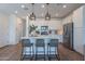Contemporary kitchen with a large island, stainless steel appliances, and a seamless flow for entertaining at 1055 W Diamondback Dr, Chandler, AZ 85286