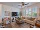 Inviting living room with a comfortable sofa, large TV, and cozy decor at 1055 W Diamondback Dr, Chandler, AZ 85286