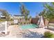 Community spa with safety railings, lounge chairs, and privacy fence at 1055 W Diamondback Dr, Chandler, AZ 85286