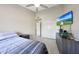 This is a standard bedroom featuring a ceiling fan and a window to let the light in at 11446 N 109Th St, Scottsdale, AZ 85259