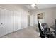 A standard bedroom with a ceiling fan and a large closet at 11446 N 109Th St, Scottsdale, AZ 85259