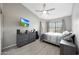 This bedroom features a ceiling fan and a window to let the light in at 11446 N 109Th St, Scottsdale, AZ 85259