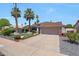Charming home featuring a well-maintained front yard with a lush landscape and a two-car garage at 11446 N 109Th St, Scottsdale, AZ 85259