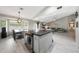 Open floor plan shows kitchen with granite island, dining area, and cozy living room at 11446 N 109Th St, Scottsdale, AZ 85259
