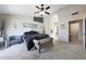 A bright main bedroom featuring a ceiling fan and neutral decor at 11446 N 109Th St, Scottsdale, AZ 85259