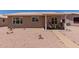 Backyard with desert landscaping and covered patio perfect for outdoor living and relaxation at 1341 E Bellerive Dr, Chandler, AZ 85249