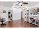 Large bonus room with vinyl floors, built-in storage, lots of natural light and room for activities at 1341 E Bellerive Dr, Chandler, AZ 85249